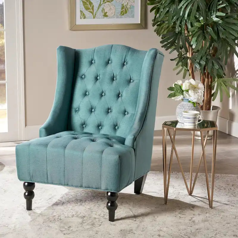 Fauteuil club capitonné à dossier haut avec accoudoirs, surpiqûres à losanges et boutons, argent