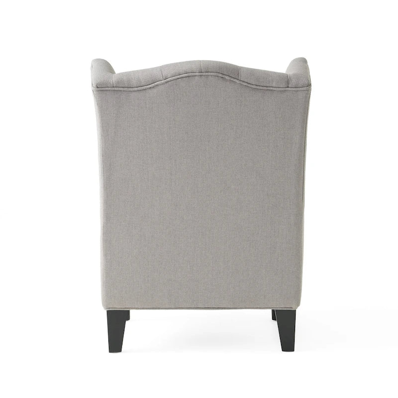 Fauteuil club capitonné à dossier haut avec accoudoirs, surpiqûres à losanges et boutons, argent
