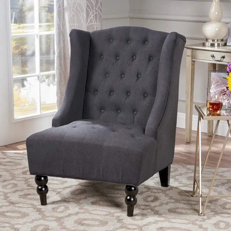 Fauteuil club capitonné à dossier haut avec accoudoirs, surpiqûres à losanges et boutons, argent