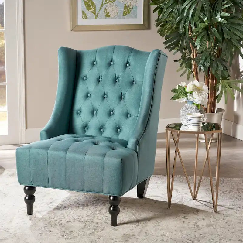 Fauteuil club capitonné à dossier haut avec accoudoirs, surpiqûres à losanges et boutons, argent