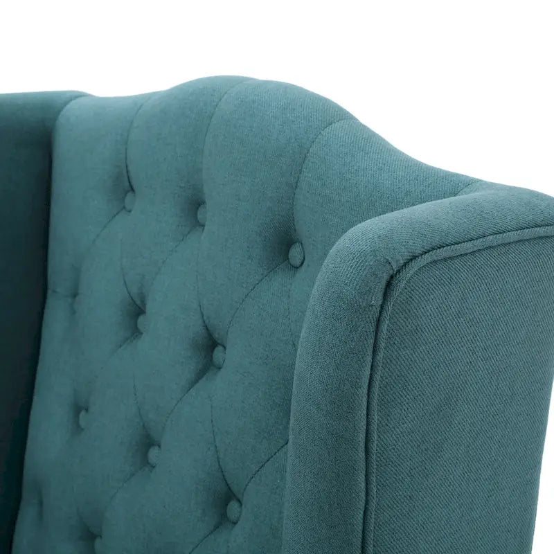Fauteuil club capitonné à dossier haut avec accoudoirs, surpiqûres à losanges et boutons, argent