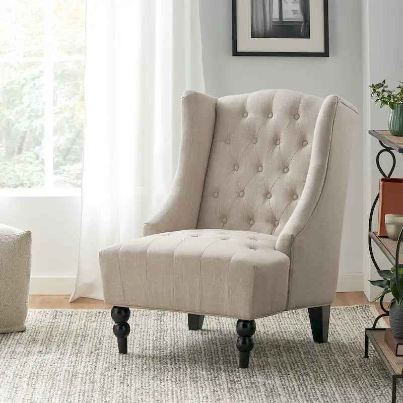 Fauteuil club capitonné à dossier haut avec accoudoirs, surpiqûres à losanges et boutons, argent